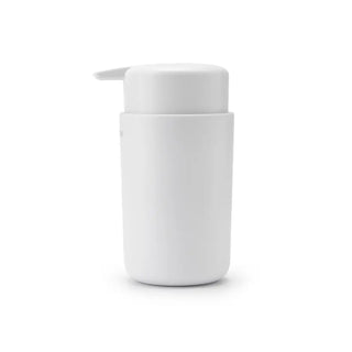 Vit cylindrisk pumpflaska för dispensering.