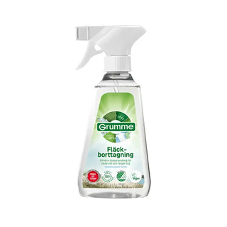 En sprayflaska i klar plast med Grümme fläckborttagningsmedel.