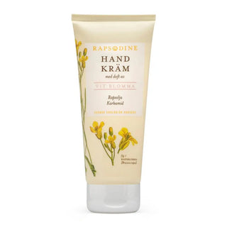 En tub med handkräm med en gul blommig design.