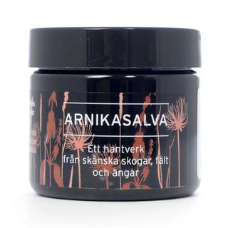 Mörkbrun burk med Arnica-salva.