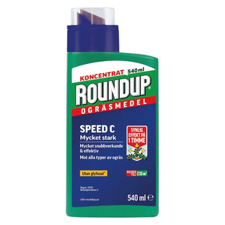 Grön plastflaska med Roundup ogräsmedel.