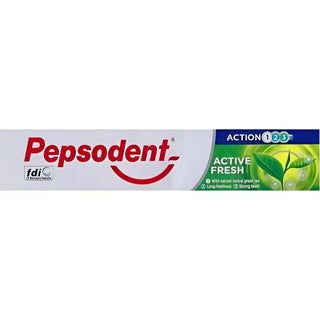 Vit tandkrämstub med rött och grönt varumärke