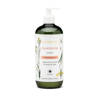 Grön och vit pumpflaska med grapefruktdoftande handdiskmedel.